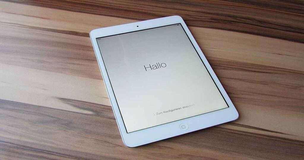 Ipad lay on the table which is 40 inches.